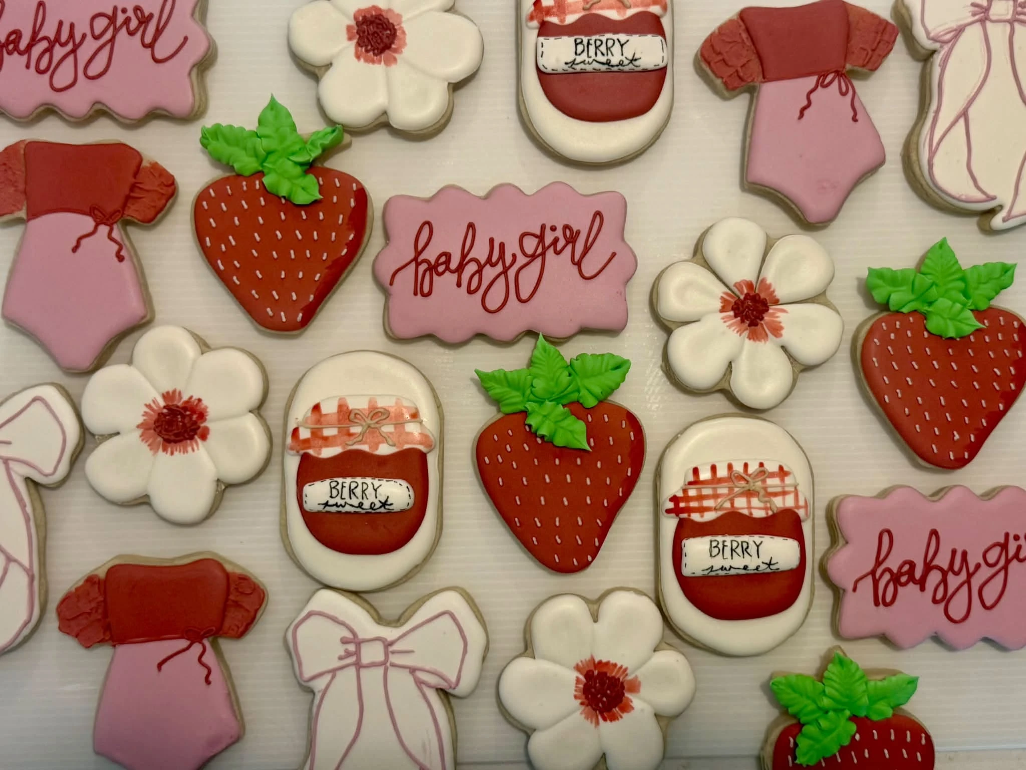 Berry Sweet strawberry-themed baby shower decorated sugar cookies