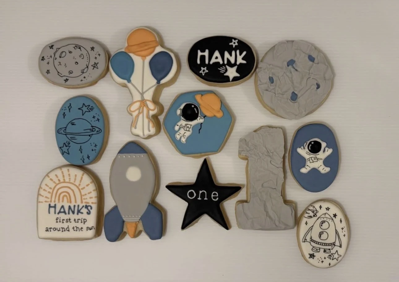Space first birthday decorated sugar cookies