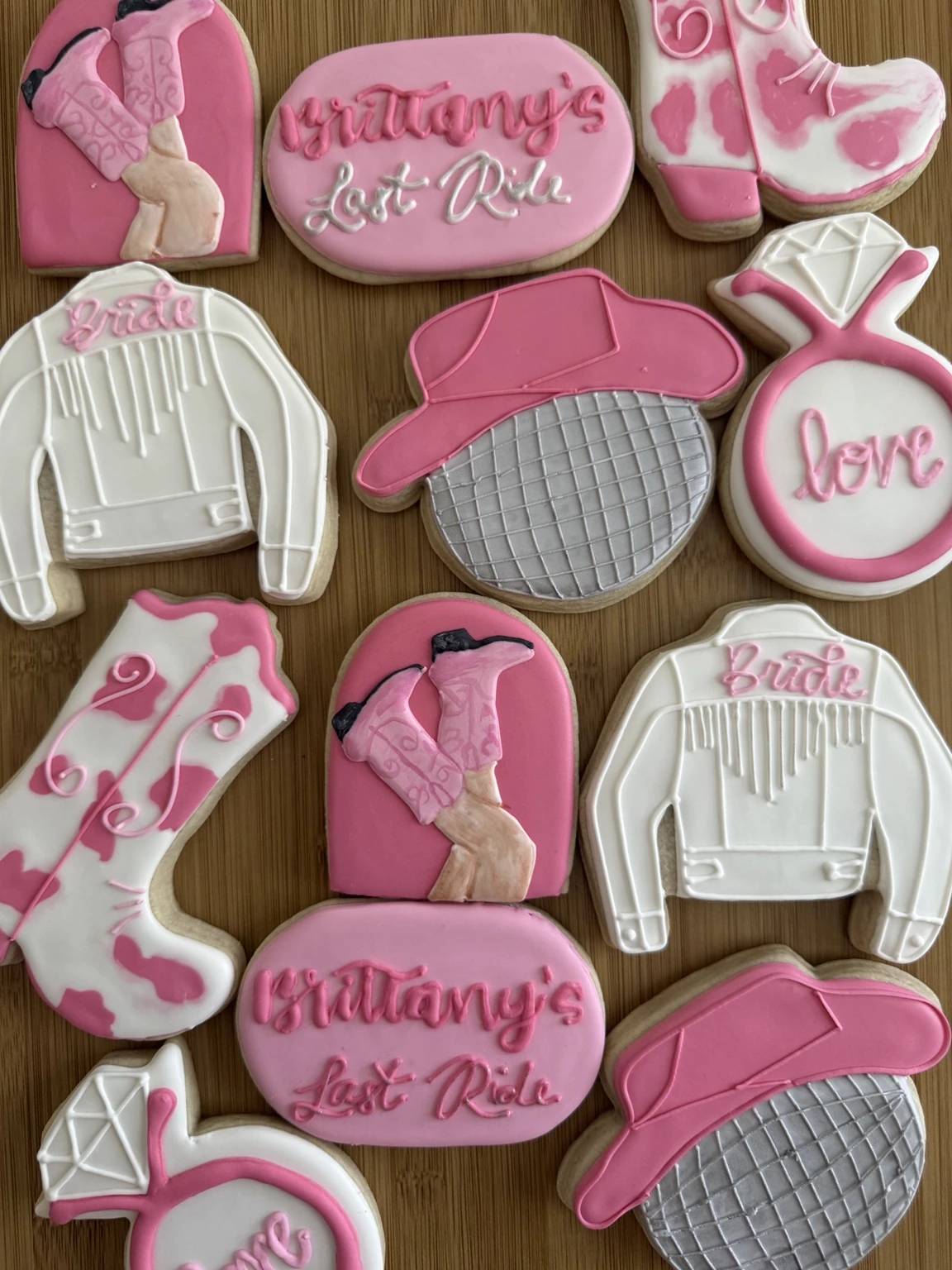 Pink western Brittany's Last Ride bridal shower decorated sugar cookies